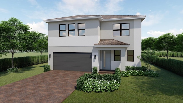 modern home featuring a front yard and a garage