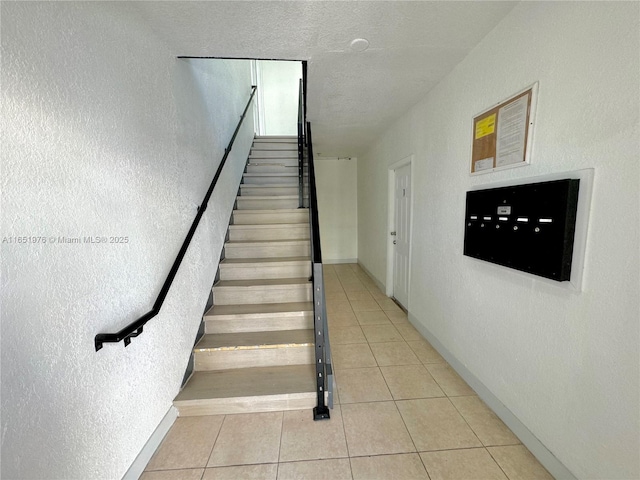 staircase featuring tile patterned flooring