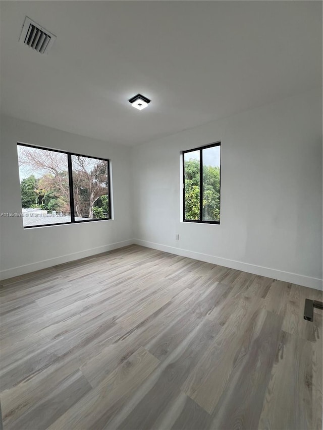 empty room with light wood-type flooring