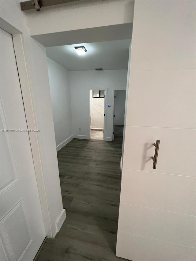 hallway featuring dark wood-type flooring