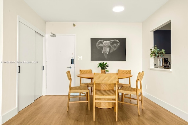 dining space featuring light wood-type flooring