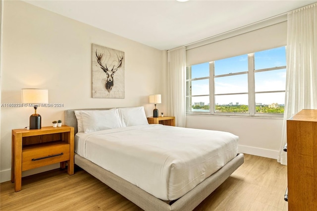 bedroom with light wood-type flooring