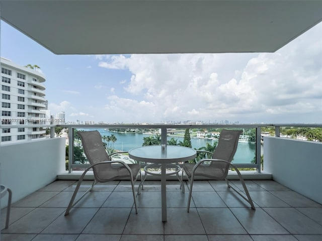 balcony featuring a water view