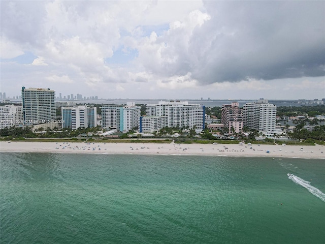 bird's eye view featuring a beach view and a water view