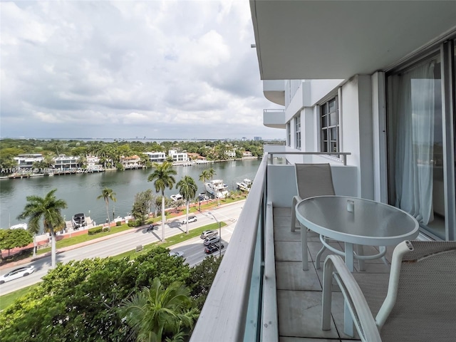 balcony featuring a water view