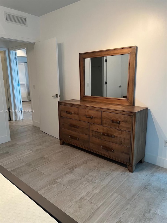 unfurnished bedroom featuring light wood-type flooring