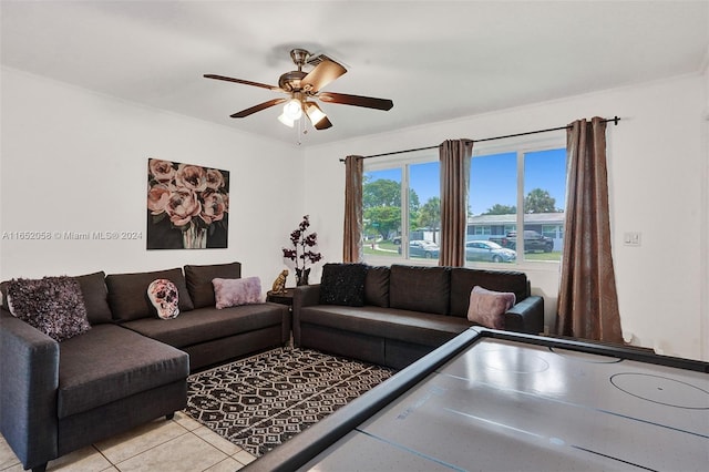 living room featuring ceiling fan and light tile patterned floors