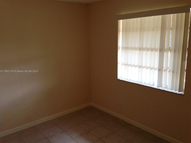 10127 Twin Lakes Dr Unit 24-J, Coral Springs, FL 33071 - unfurnished room featuring tile patterned flooring and baseboards