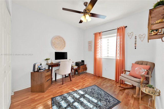 home office featuring hardwood / wood-style flooring and ceiling fan