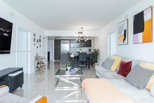 living area with an inviting chandelier