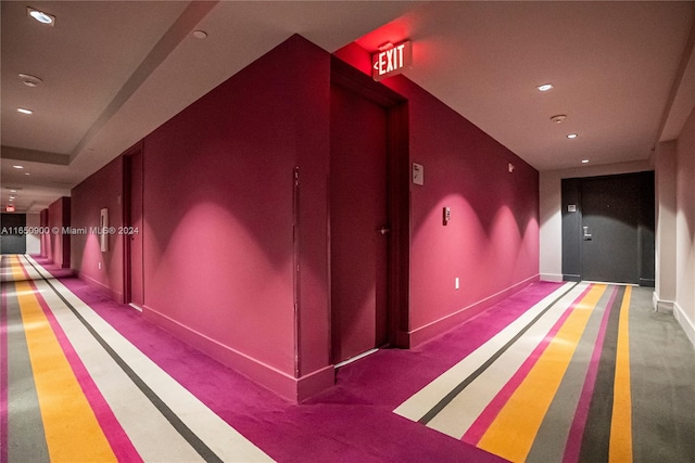 corridor with recessed lighting, carpet, and baseboards