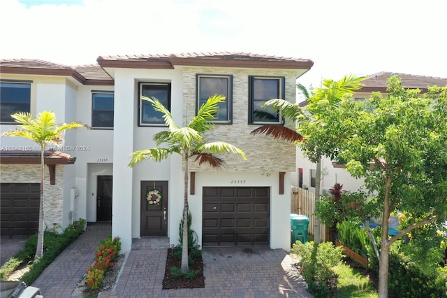 mediterranean / spanish-style home featuring a garage