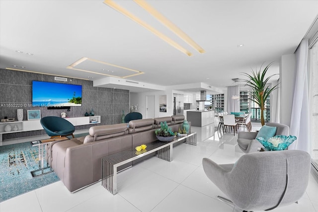 living room featuring tile walls and light tile patterned flooring