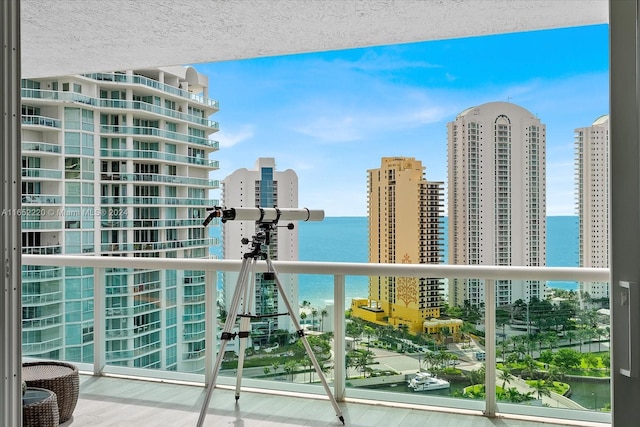 balcony featuring a water view