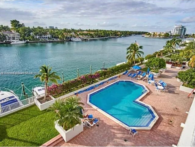 5700 Collins Ave Unit 8B, Miami Beach, FL 33140 - community pool with a water view and a patio