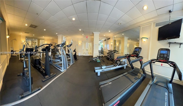 exercise room featuring a paneled ceiling