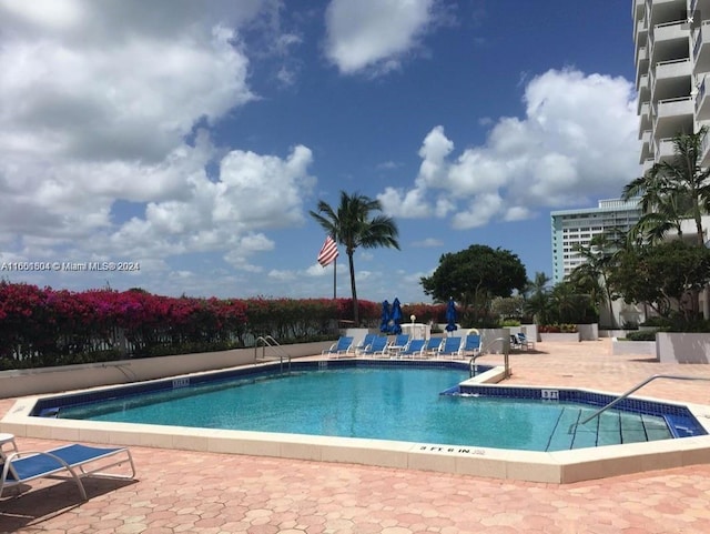 5700 Collins Ave Unit 8B, Miami Beach, FL 33140 - community pool featuring a patio area