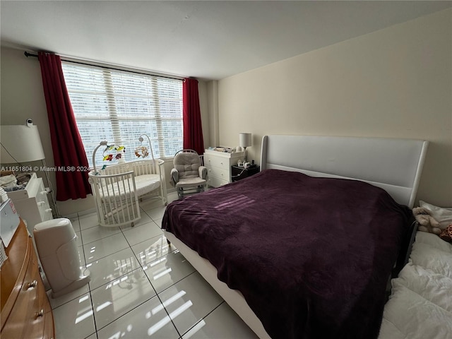 bedroom featuring light tile patterned floors