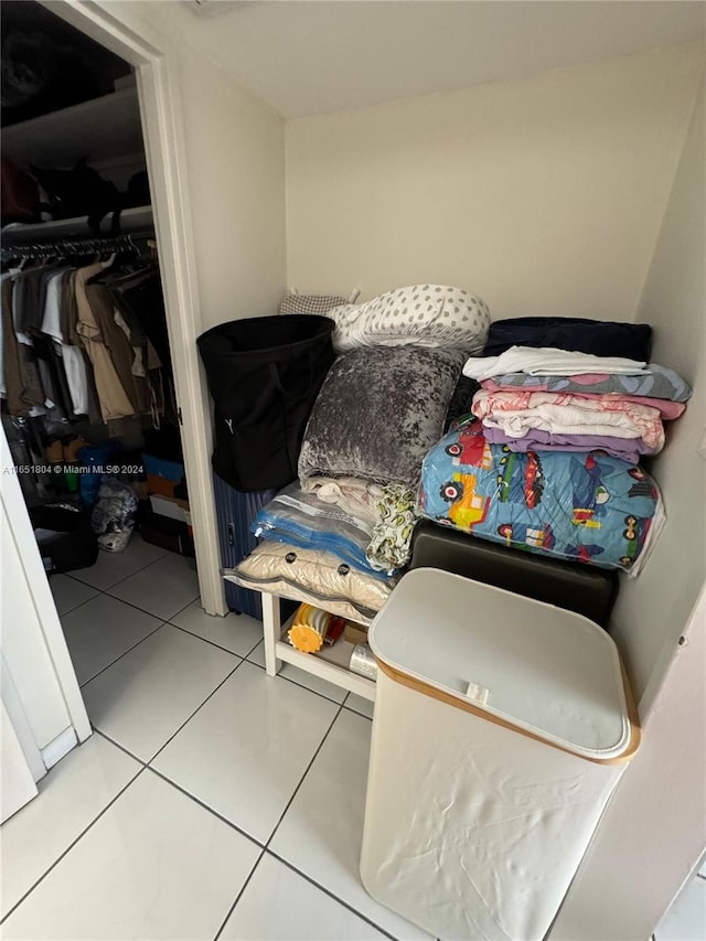 bedroom featuring light tile patterned flooring and a closet