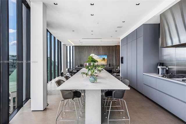 dining space with a wall of windows