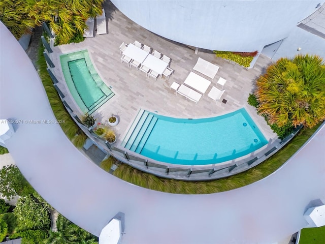 view of swimming pool featuring a patio area