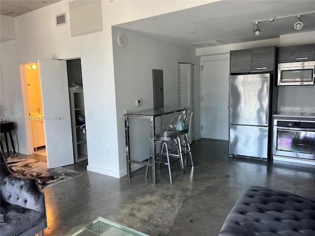 kitchen with appliances with stainless steel finishes and electric panel