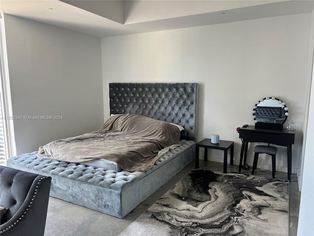 bedroom with concrete flooring