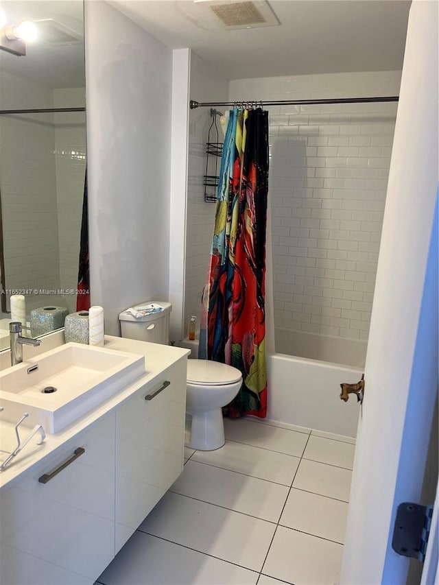 full bathroom with vanity, toilet, shower / tub combo with curtain, and tile patterned floors