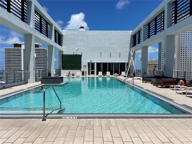 view of pool featuring a patio area