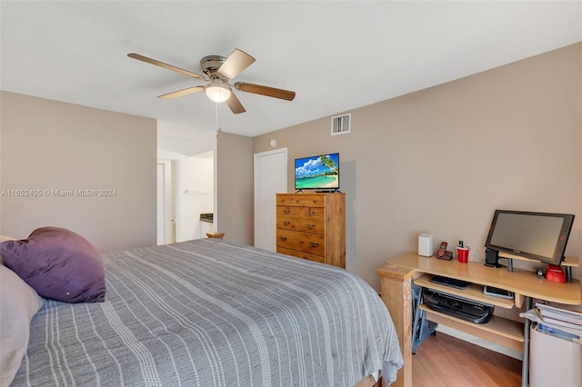 bedroom featuring hardwood / wood-style floors and ceiling fan