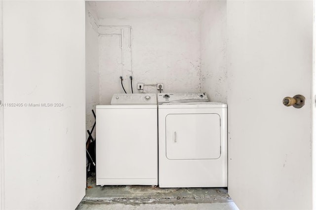 washroom featuring washer and clothes dryer