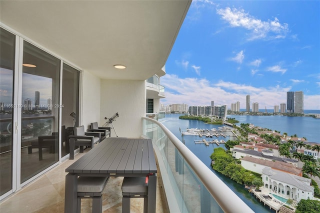 balcony featuring a water view