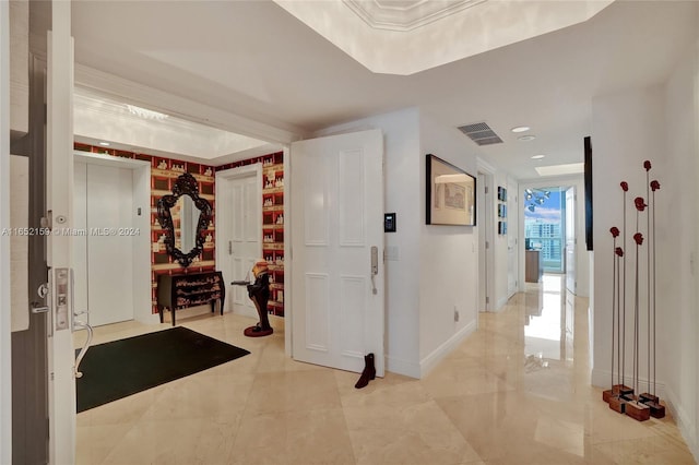 hallway featuring ornamental molding