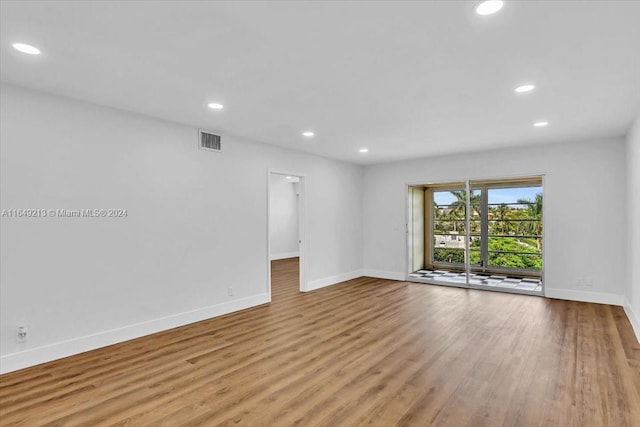 spare room featuring light hardwood / wood-style flooring