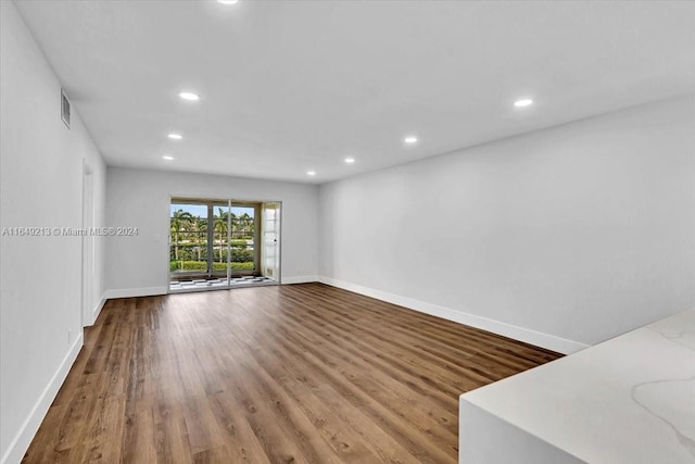 spare room with hardwood / wood-style flooring