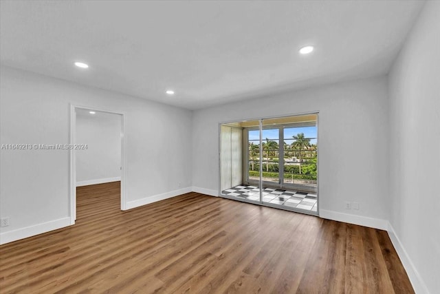 spare room featuring hardwood / wood-style flooring