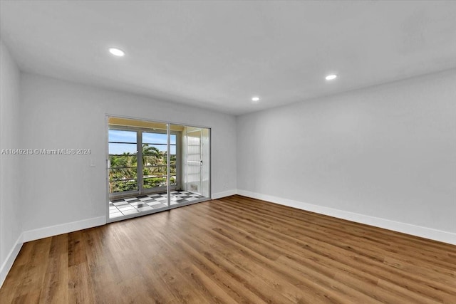 unfurnished room with light hardwood / wood-style floors