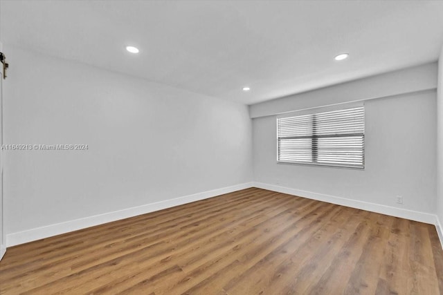 unfurnished room featuring light hardwood / wood-style flooring