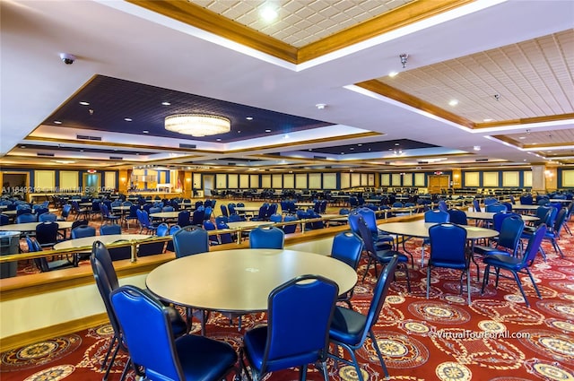 dining space featuring carpet flooring, a raised ceiling, and crown molding