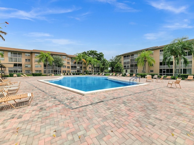 view of swimming pool with a patio area