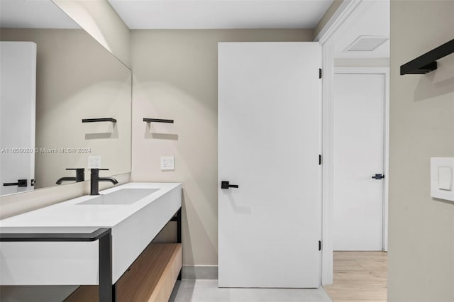 bathroom featuring vanity and hardwood / wood-style flooring