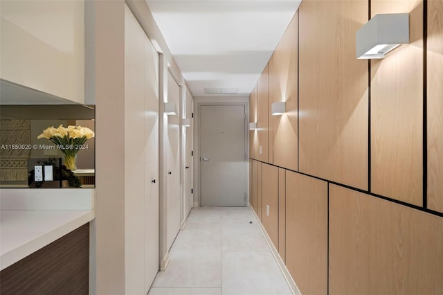 corridor featuring light tile patterned floors