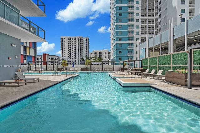 view of swimming pool with a patio area