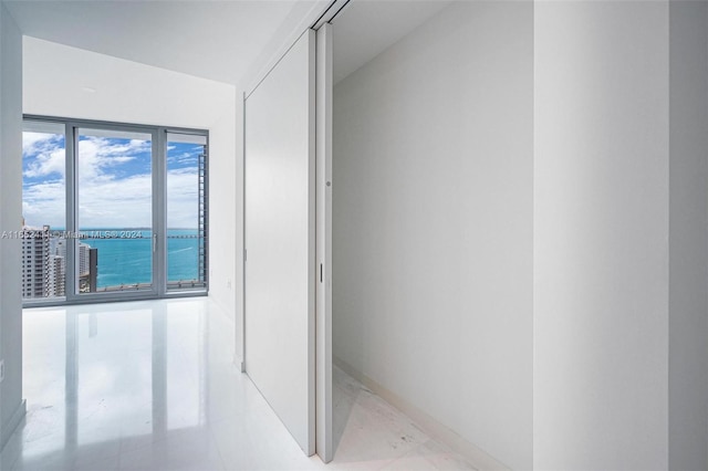 bathroom with a healthy amount of sunlight and a water view