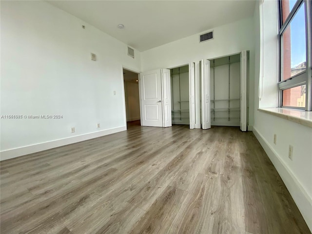 unfurnished bedroom featuring hardwood / wood-style floors