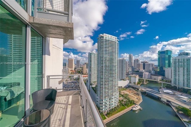 balcony featuring a water view