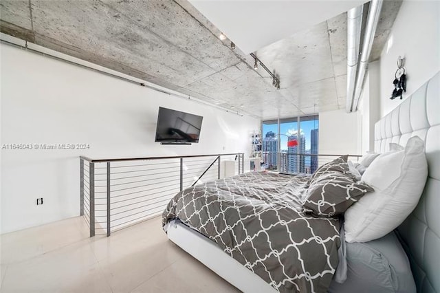 bedroom featuring concrete flooring