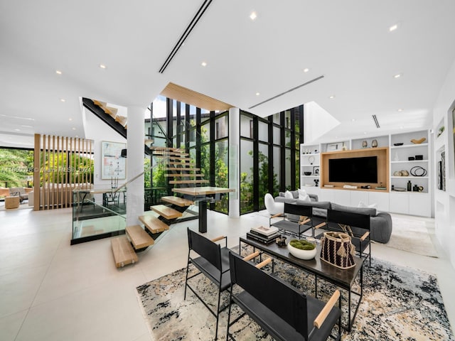 living room featuring floor to ceiling windows