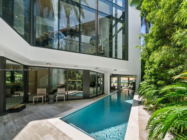 view of swimming pool featuring a patio area