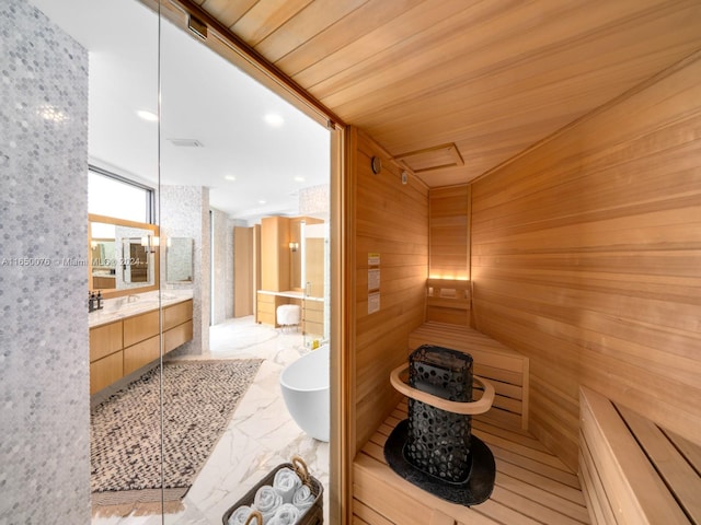 view of sauna with wood ceiling and wooden walls